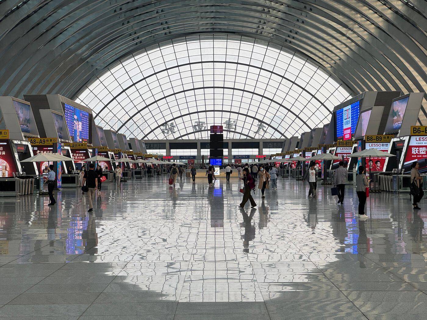 Bright airport terminal concourse with travellers