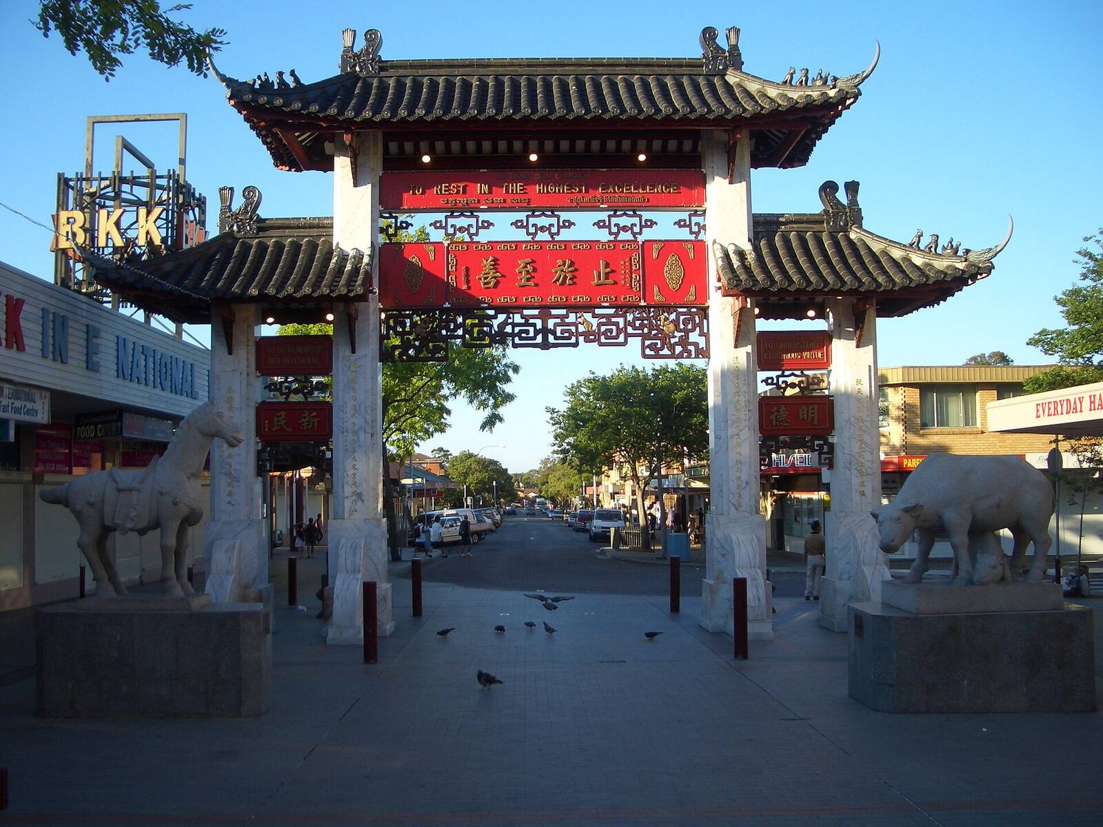 The Pai Lau gateway at the entrance to Freedom Plaza in Cabramatta, with stone horse and ox statues either side