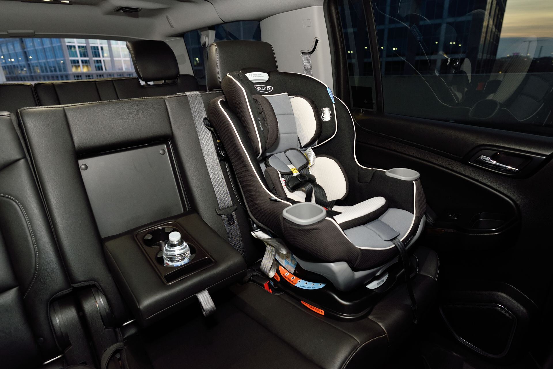 Child car seat installed in the back seat of a vehicle