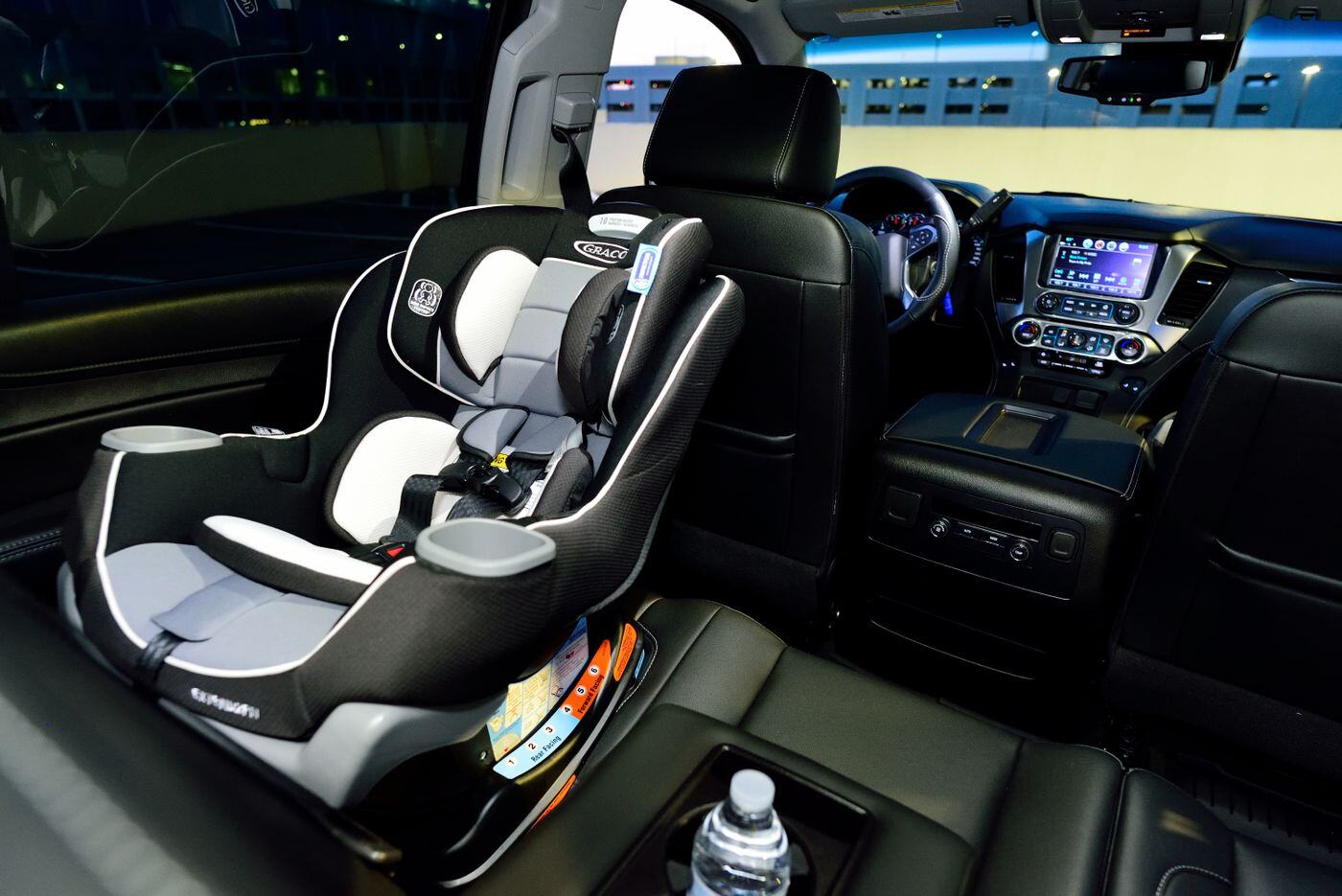 Child car seat installed in the rear seat of a vehicle