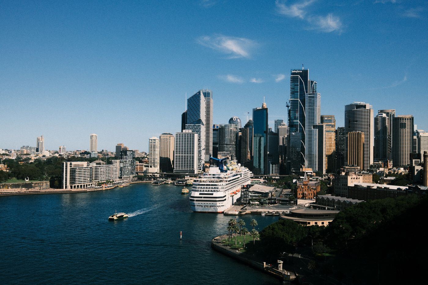 Aerial view of Circular Quay with a cruise ship moored at the Overseas Passenger Terminal below the city towers