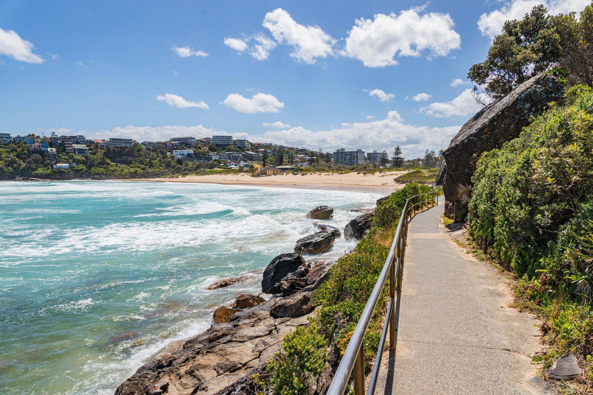 Coastal walking path above the surf at Freshwater Beach on the Northern Beaches