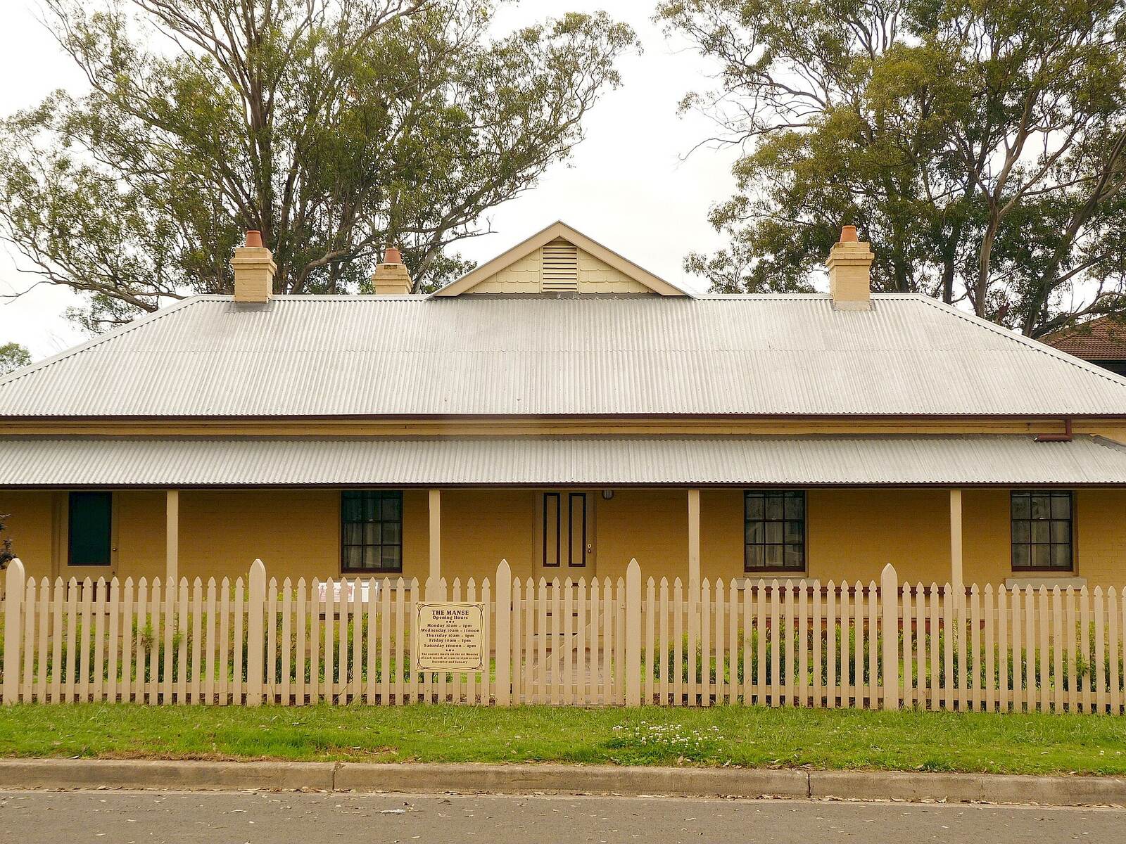 The Manse, a single-storey Georgian-style cottage with a picket fence on The Avenue, Mount Druitt