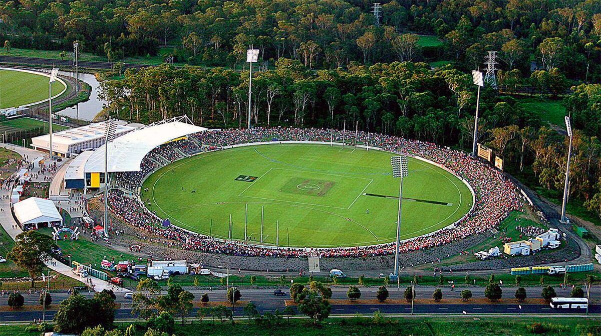 Aerial view of the oval at Blacktown International Sportspark on Eastern Road, with a crowd around the boundary and bushland behind