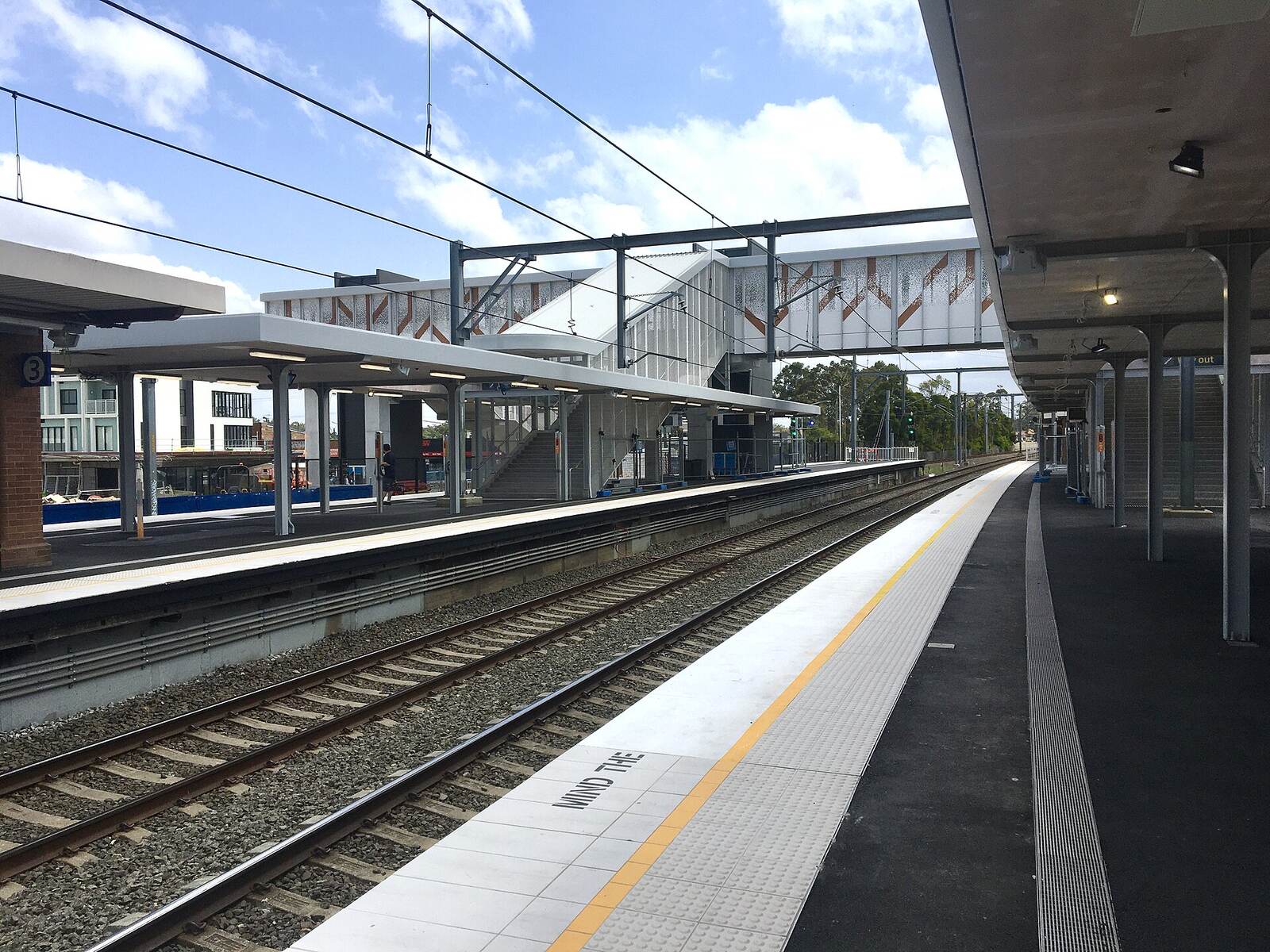 Rooty Hill station platform with the new footbridge and lift towers from the station upgrade
