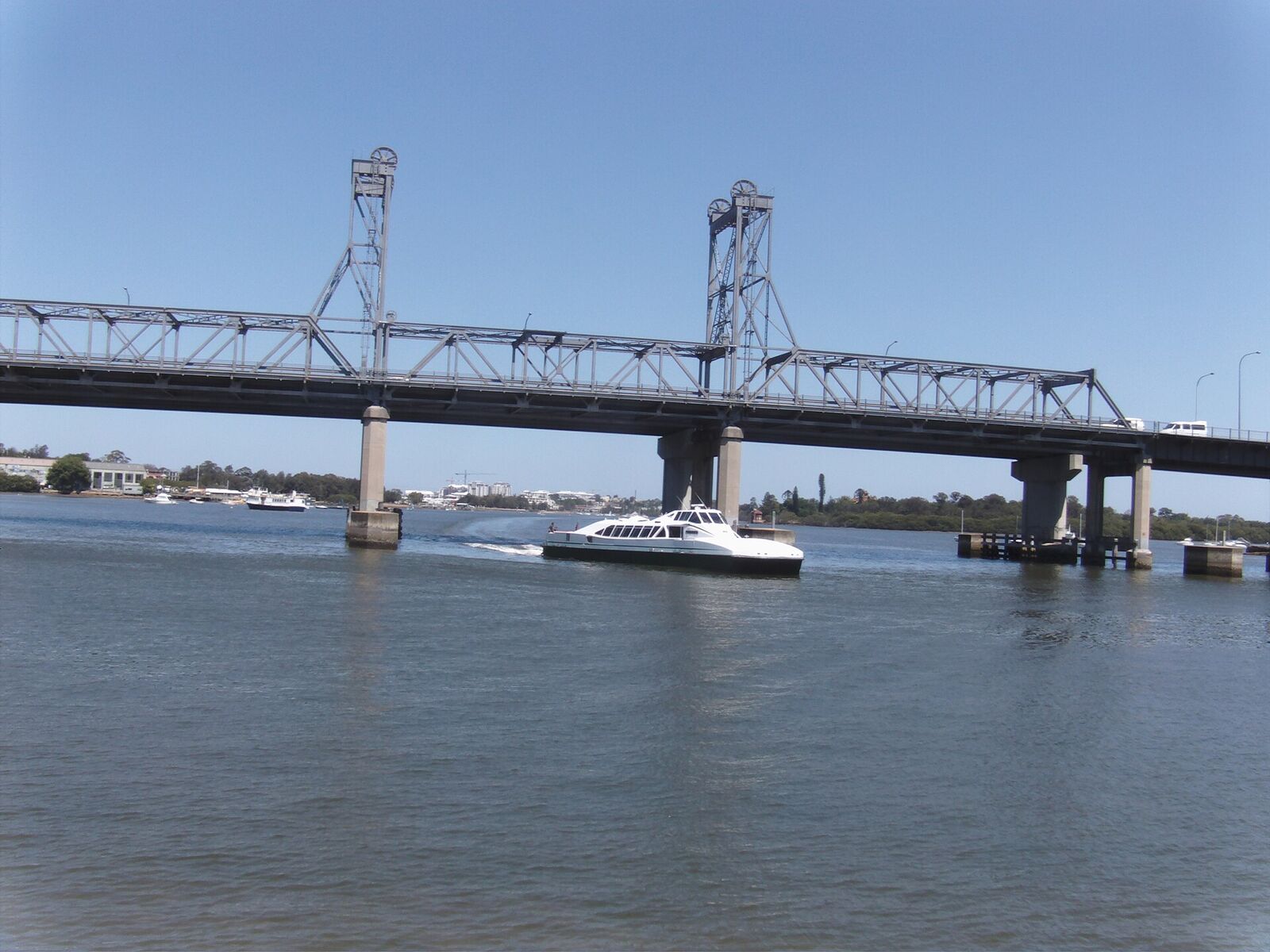 RiverCat ferry passing under the lift spans of Ryde Bridge on the Parramatta River