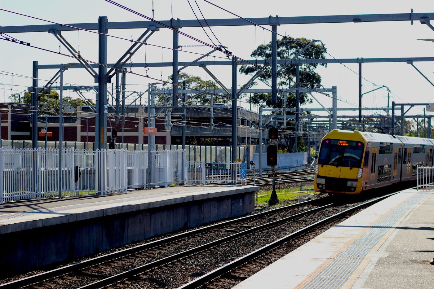 Sydney Trains Waratah train arriving at a suburban station platform