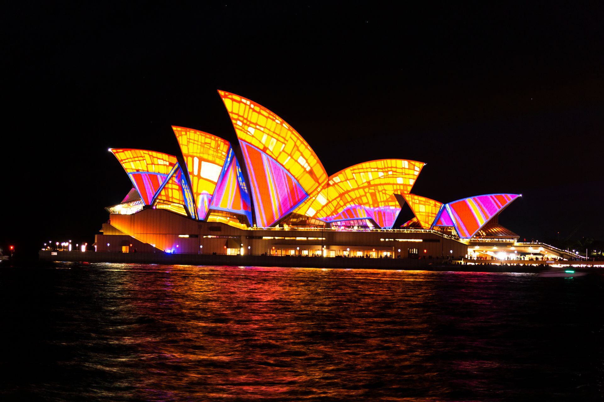 Sydney Opera House sails lit in bright colours during Vivid Sydney